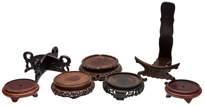 Lot 801 - A GROUP OF SEVEN CHINESE CARVED WOOD STANDS