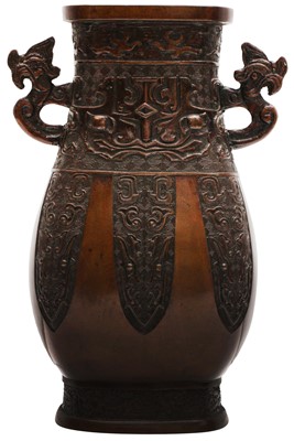 Lot 665 - A CHINESE ARCHAISTIC BRONZE TWIN-HANDLED VASE, HU