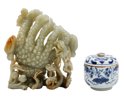 Lot 75 - A CHINESE JADE 'FINGER CITRON' CARVING AND A SMALL BLUE AND WHITE POT