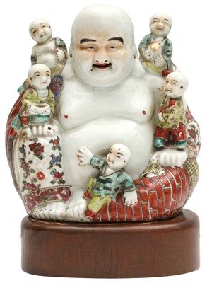 Lot 600 - A CHINESE FAMILLE-ROSE FIGURE OF THE LAUGHING BUDDHA, BUDAI