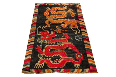Lot 52 - AN ANTIQUE TIBETAN RUG