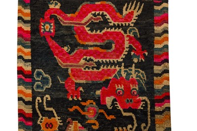 Lot 52 - AN ANTIQUE TIBETAN RUG