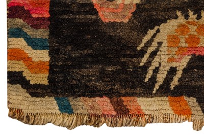 Lot 52 - AN ANTIQUE TIBETAN RUG