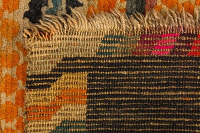Lot 52 - AN ANTIQUE TIBETAN RUG