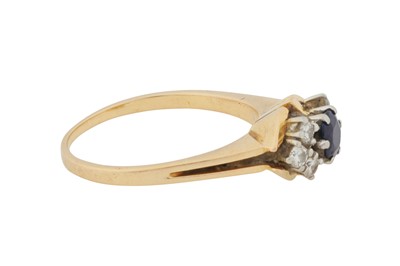 Lot 215 - A SAPPHIRE AND DIAMOND RING, CIRCA 1975