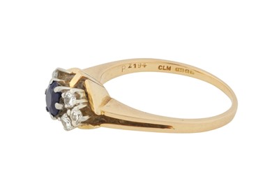 Lot 215 - A SAPPHIRE AND DIAMOND RING, CIRCA 1975