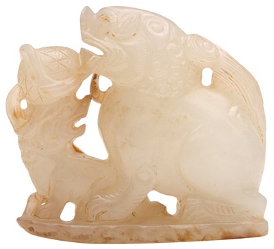 Lot 96 - A CHINESE CELADON JADE 'LION DOG' GROUP