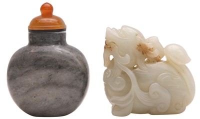 Lot 619 - A CHINESE JADE CARVING OF A MYTHICAL BEAST TOGETHER WITH A SNUFF BOTTLE