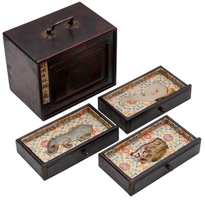 Lot 136 - A group of Chinese archaistic jade plaques with box and cover, 19th Century or earlier