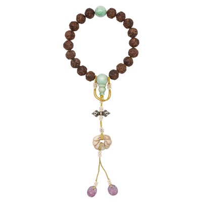 Lot 137 - A Chinese agarwood 'chenxiangmu' and jade rosary, Qing dynasty