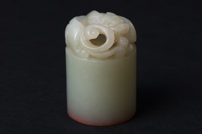 Lot 79 - A CHINESE CARVED CELADON JADE 'CHILONG' SEAL