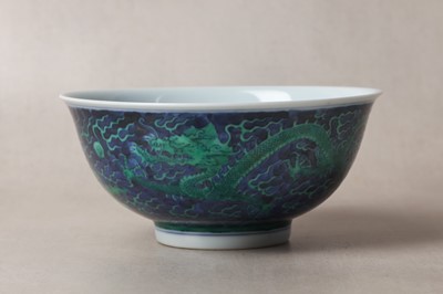 Lot 15 - A CHINESE GREEN-ENAMELLED BLUE-GROUND 'DRAGON' BOWL