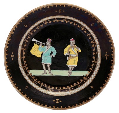 Lot 291 - A RARE CHINESE EXPORT BLACK-GROUND 'TRUMPETER' DISH