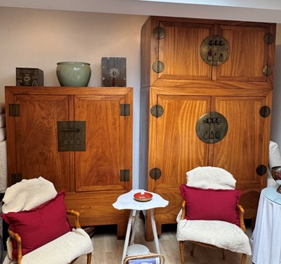 Lot 77 - A NEAR-PAIR OF CHINESE WOOD MARRIAGE CABINETS