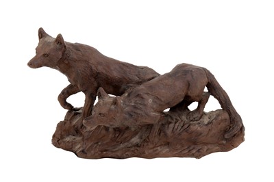 Lot 243 - A BRONZED CERAMIC FIGURAL GROUP OF TWO WOLVES, LATE 20TH/21ST CENTURY