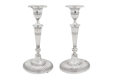 Lot 392 - A pair of George V sterling silver candlesticks, Sheffield 1918 by Walker and Hall