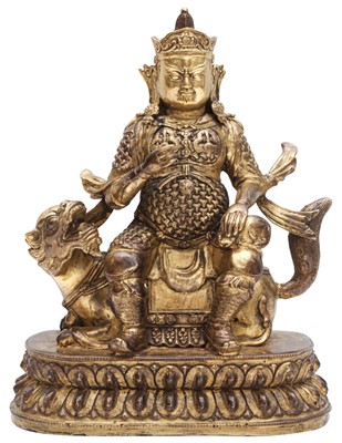 Lot 670 - A Chinese gilt-bronze figure of Vaisravana, Qing Dynasty