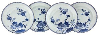 Lot 365 - Four Chinese export blue and white 'peony' dishes, Qing Dynasty, 18th century