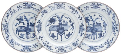 Lot 355 - Three Chinese export blue and white 'scholar treasures' dishes, Qing Dynasty, Kangxi Period