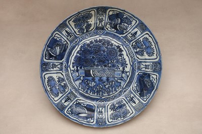 Lot 281 - A fine and very large Chinese blue and white 'Kraak' charger, Ming Dynasty, Wanli Period