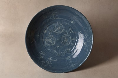 Lot 108 - A rare Chinese blue-glazed and slip-decorated Zhangzhou (Swatow) dish, Ming Dynasty, Wanli Period
