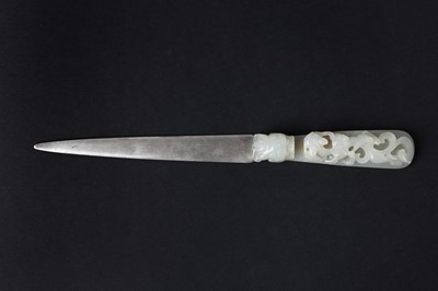 Lot 85 - A Chinese jade 'chilong' belt hook mounted with a silver letter opener, Qing Dynasty