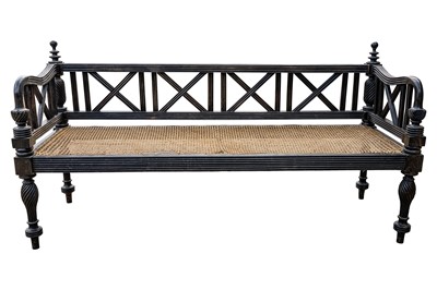 Lot 40 - An early 19th century Ceylon (Sri Lanka) carved and caned ebony sofa