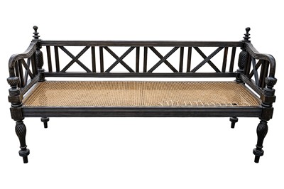 Lot 39 - An early 19th century Ceylon (Sri Lanka) carved and caned ebony sofa