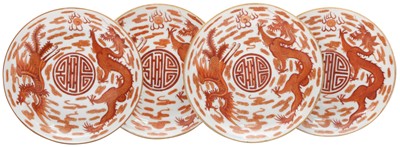 Lot 576 - FOUR CHINESE IRON-RED 'DRAGON AND PHOENIX' DISHES