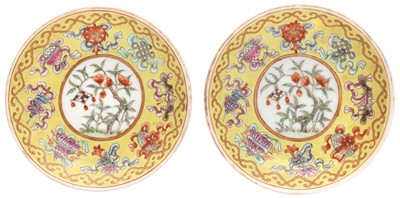 Lot 580 - A PAIR OF CHINESE FAMILLE-ROSE YELLOW-GROUND SAUCERS