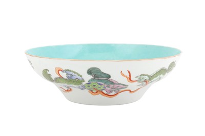 Lot 45 - A CHINESE FAMILLE-ROSE 'LION DOGS' BOWL