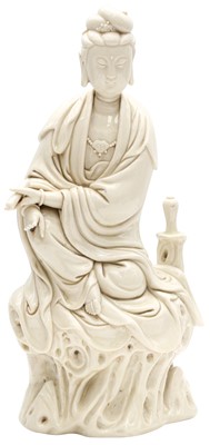 Lot 770 - A CHINESE DEHUA FIGURE OF A SEATED GUANYIN