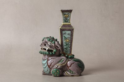 Lot 13 - A CHINESE BISCUIT FAMILLE-VERTE 'LION DOG' CANDLE HOLDER