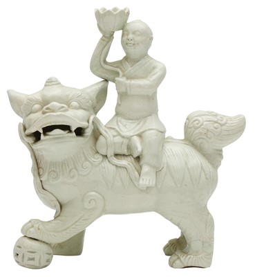 Lot 764 - A CHINESE QINGBAI 'BOY AND LION' FIGURE
