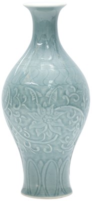 Lot 585 - A CHINESE CELADON-GLAZED 'LOTUS' VASE