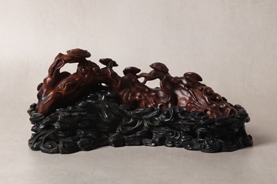 Lot 17 - A CHINESE HARDWOOD HUALI 'LINGZHI' CARVING