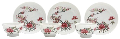 Lot 268 - THREE CHINESE FAMILLE-ROSE 'BLOSSOMS' CUPS AND SAUCERS