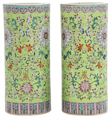 Lot 48 - A PAIR OF CHINESE FAMILLE-ROSE LIME GREEN-GROUND HAT STANDS