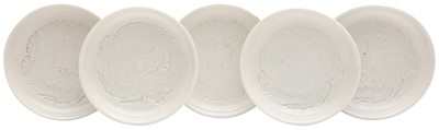 Lot 554 - FIVE CHINESE MONOCHROME WHITE-GLAZED 'DRAGON' DISHES