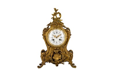 Lot 115 - A Louis XV style mantel clock