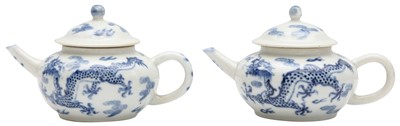 Lot 807 - TWO SMALL CHINESE BLUE AND WHITE 'DRAGONS' TEAPOTS AND COVERS