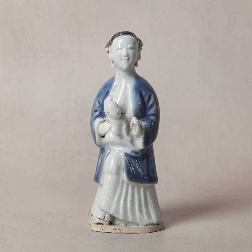 Lot 499 - A rare Chinese export glazed-biscuit 'lady and child' figure, Qing dynasty, Qianlong period