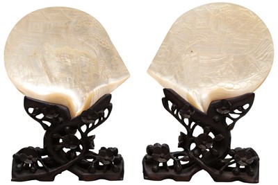 Lot 883 - A PAIR OF CHINESE 'FIGURATIVE' SHELL CARVINGS WITH CARVED WOOD STANDS