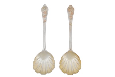 Lot 330 - An unusual pair of Victorian sterling silver gold inlaid fruit serving spoons, London 1882 by Francis Higgins