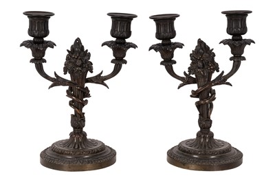 Lot 73 - A pair of French patinated bronze twin-branch candelabra