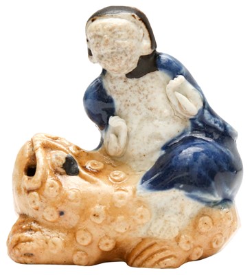 Lot 509 - A Chinese biscuit porcelain 'Liu Hai' water dropper, Qing dynasty, Kangxi period