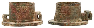 Lot 145 - A PAIR OF CHINESE ARCHAIC BRONZE CHARIOT AXLE CAPS