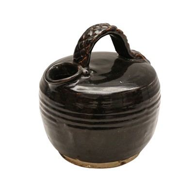 Lot 264 - A Chinese Henan black-glazed chamber pot, Ming dynasty