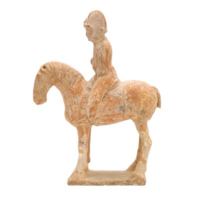 Lot 248 - A Chinese pottery figure of a horse and rider, Tang dynasty