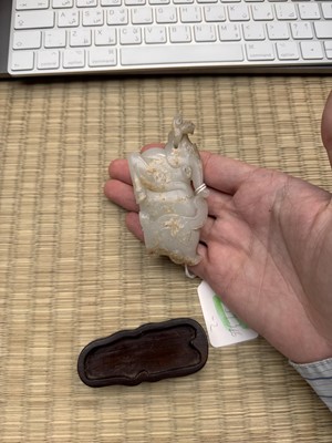 Lot 108 - A CHINESE PALE CELADON 'WATER BUFFALO' JADE CARVING